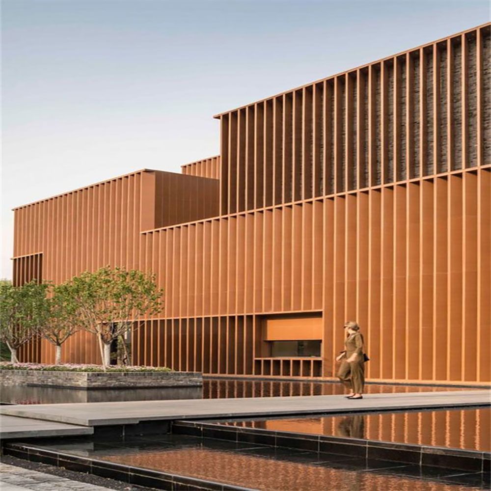 Real weathering steel panel façade with white architectural volumes